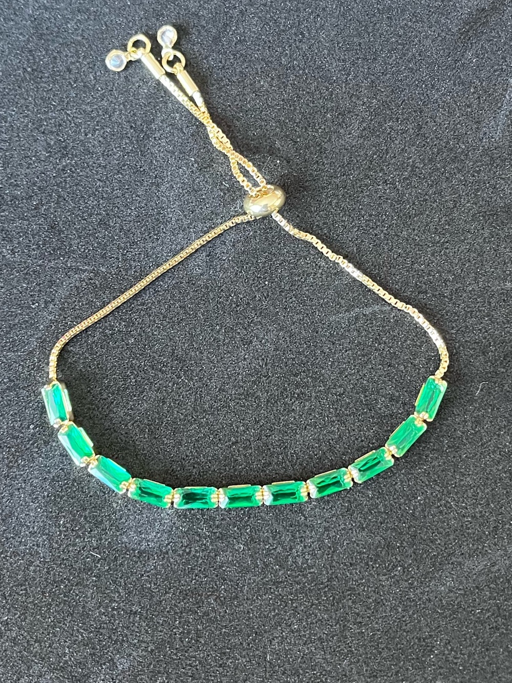 Gold Bracelet with Emerald Green Baguette Stones